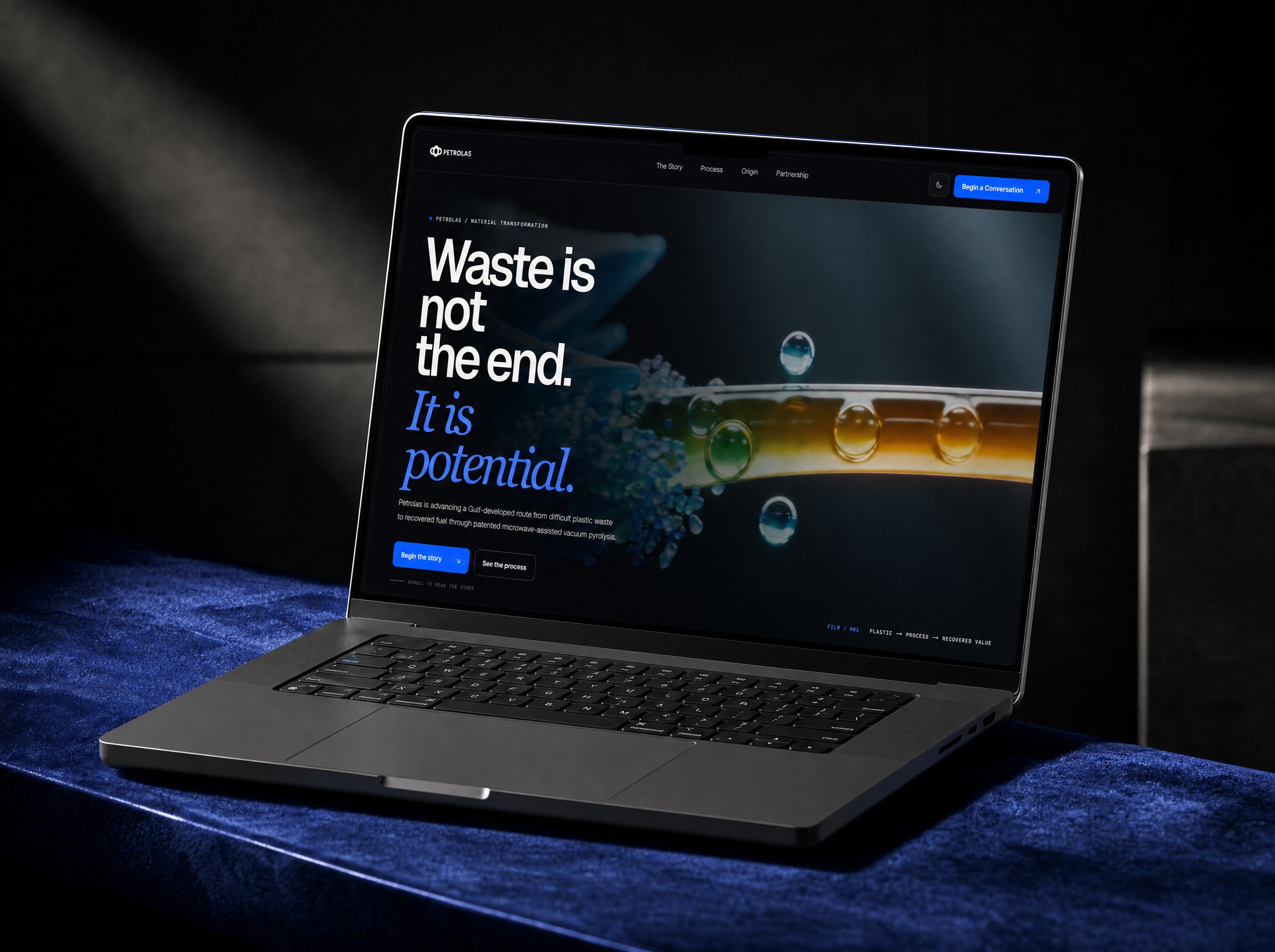 The Petrolas website on a laptop set on blue velvet in a dark room, its headline reading Waste is not the end. It is potential.
